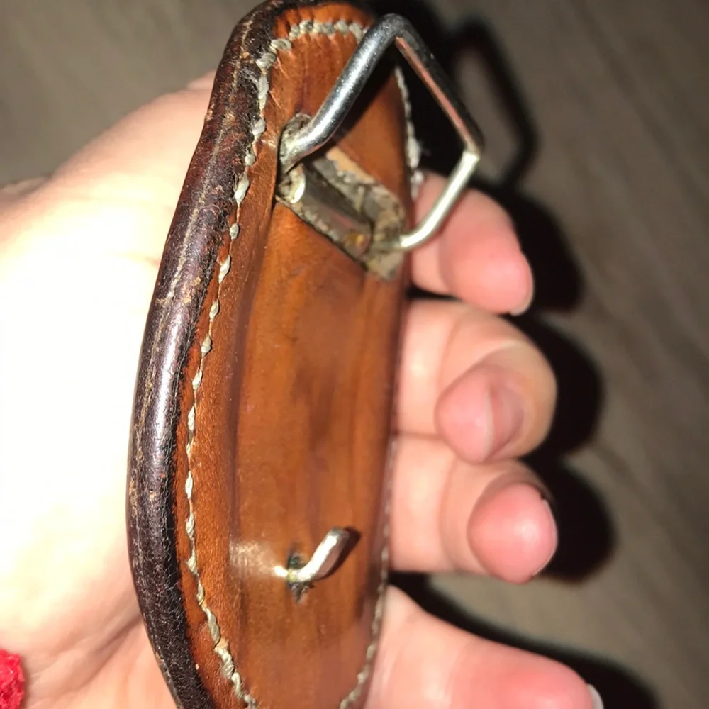 - Handcrafted leather seat belt buckle in brown